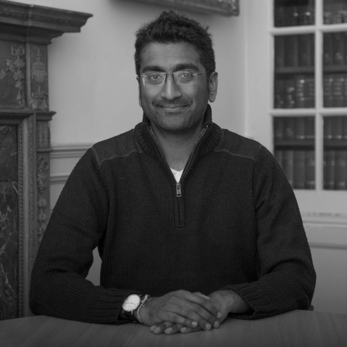 A black and white picture of Dr Deval Desai