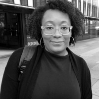 A black and white picture of Dr Désha Osborne