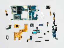 Re-materialising the Digital: a deconstructed iPhone in pieces neatly laid out
