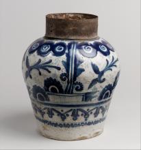 The blue-and-white jar would have had a lid with a lock (missing in this piece) and would have been used to store cacao beans or other valuable comestibles. It is decorated with motifs inspired from Chinese, European, Hispano-moresque and indigenous art.