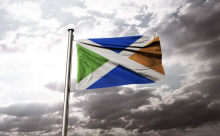 A hybrid flag combining the flag of the Republic of Ireland with the Scottish saltire