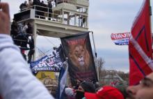 January 6 2021 at the US Capitol. A flag with the image of a lion and the words "Proverbs 30:30"