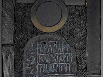 Black Sun of Winter, a slate mosaic on a wood panel with a large central section with incised runic inscriptions, by George Garson, 1980.