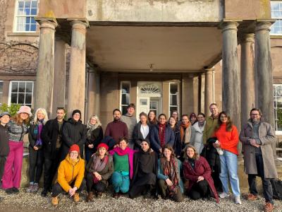 Fellows at the Burn in the Highlands, Nov 2024 - a group of people stand in front of a house
