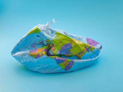A deflated beach ball with the design of a globe