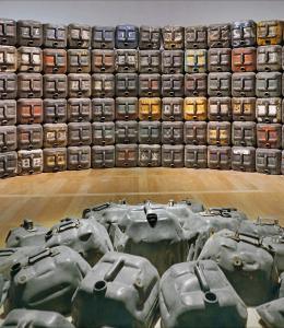 Image of oilcans stacked into a wall. Image by Jean-Pierre Dalbéra. https://www.flickr.com/photos/dalbera/51422594515/