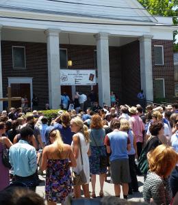 The image shows the crowd outside the Charleston church shooting memorial service in 2015. As the ch